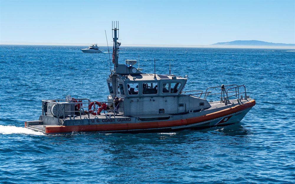 U.S. Coast Guard response boat crossing blue water on a clear day